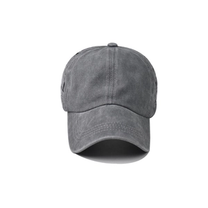 Detail of washed grey cotton fabric and stitching on a vintage criss-cross ponytail cap