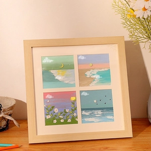 Square wood frame with four-grid oil pastel paintings featuring nature scenery