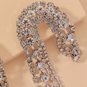 Silver drop earrings with sparkling rhinestones and asymmetrical U-shape fringe design