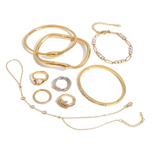 Set elegante di anelli a serpente oro e argento con cristalli e bracciali abbinati