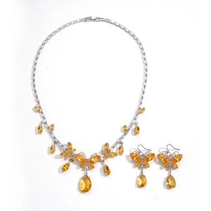 Retro palace style jewelry set with butterfly and teardrop yellow gemstone pendants