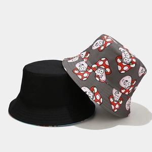 Cute reversible mushroom bucket hat in black and grey with cartoon print for sun protection