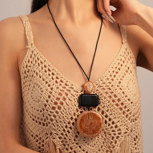 Long resin sweater necklace with amber geometric pendants on a minimalist black cord
