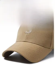 Close-up of precise multi-row brim stitching and beige 3D S embroidery on khaki cap