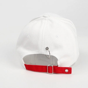 Detail view of white cotton baseball cap back with red strap and silver metal rings