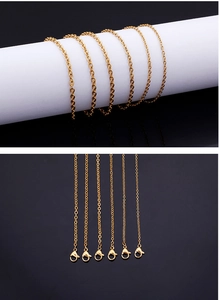 Detail of gold stainless steel flat link chains with lobster clasps for DIY jewelry