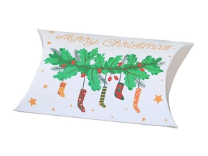 Close-up of white paper Christmas pillow box with holly berries and Merry Christmas text