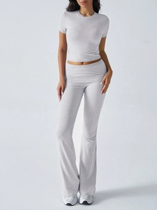 Close-up of soft grey cotton blend fabric on women short sleeve tee and flare pants