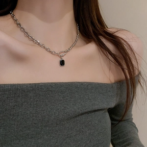 Chic stainless steel necklace with square black pendant on model for minimalist style