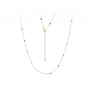 Detail of gold necklace featuring colorful beads and adjustable tail chain on white background