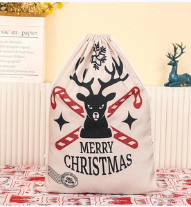 Detail of Christmas canvas drawstring gift bag with reindeer print and North Pole stamp