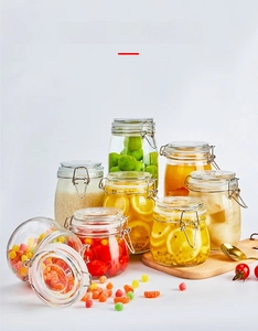 Various sizes of glass storage jars with airtight metal clamps for fresh food preservation