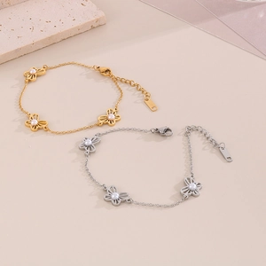 Elegant gold and silver butterfly charm bracelets with pearls and O-chain links