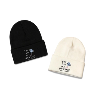 Black and cream knitted beanies with Universe embroidery and moon star patterns