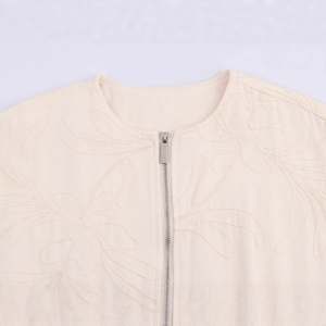 Chic apricot embroidered jacket featuring a round neck with detailed floral stitching
