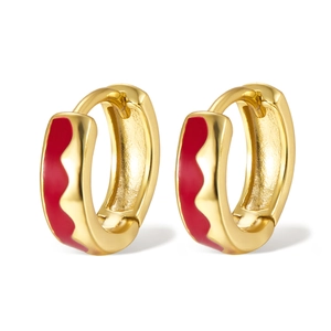 Detailed close-up of 925 silver hoop earrings with red enamel wave patterns in gold