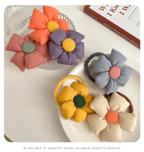Detail showing the colorful 3D fabric flower hair ties with high elasticity bands