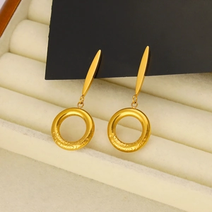 Minimalist 18K gold plated stainless steel drop earrings with engraved hoop on white velvet