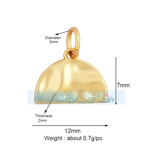 Detail of a 12mm x 7mm golden textured semicircle pendant with measurement markers