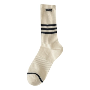 Striped cotton crew socks in off-white with black stripes and brand woven label