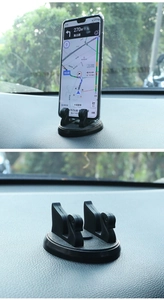 Dual-slot car phone mount showing stable phone placement on vehicle dashboard