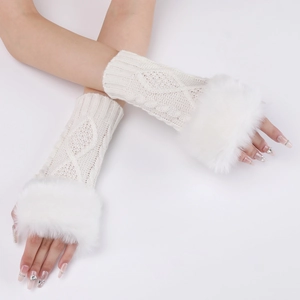 Detail of white cable knit fingerless gloves featuring plush faux fur trim on the cuffs