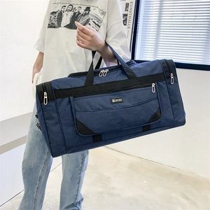 Detail of navy nylon travel bag with Sport logo and durable multiple zipper pockets
