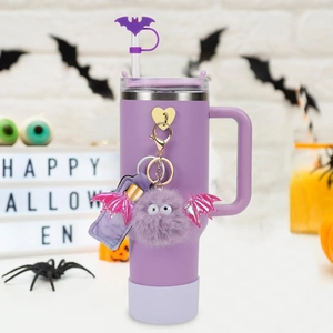 Purple 40oz insulated tumbler with Halloween bat straw topper and gothic accessories