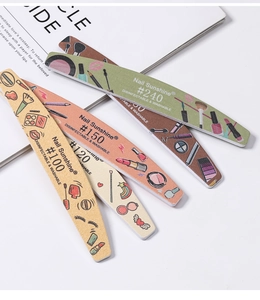 Close-up of fan-shaped spread of assorted grit double-sided nail files with patterns