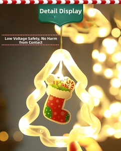 Macro detail of warm LED Christmas hanging light with festive stocking and candy patterns