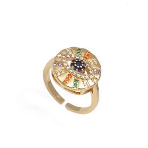 Close-up of golden evil eye ring with micro-paved blue, green, and orange zircons