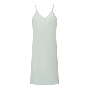 Detail of light green satin maxi dress with V-neckline and elegant pleated waist design