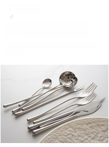 Close-up of polished 304 stainless steel cutlery with minimalist curved handle design