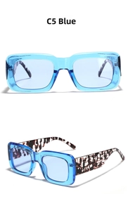 Detail of square blue transparent frames and vintage tortoiseshell patterns on temple