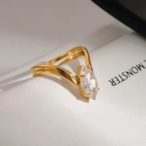 Close-up of 18k gold plated stainless steel ring with marquise cut zircon in V-shape
