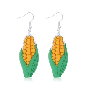 Detail view of creative yellow corn drop earrings with green husks and silver hooks