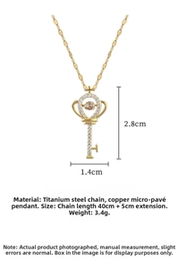 Detailed view of crown key pendant with 2.8cm height and dancing zircon stone inlay