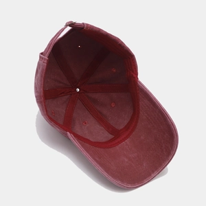 Macro view of the internal structure and metallic buckle of the washed cotton baseball cap