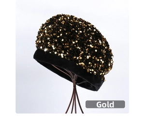 Detail of a black beret featuring gold sequins on a vintage metal stand in a studio setting