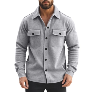Detail of grey fleece-lined shirt jacket showing front pockets and black buttons
