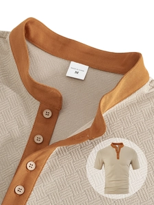 Detail view of khaki and orange textured knit fabric on short sleeve button shirt