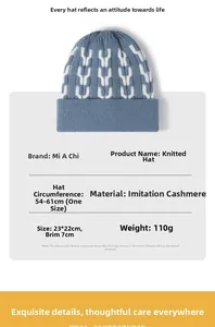 Detail showing blue knit hat with white U-pattern and specifications for cashmere-like fabric