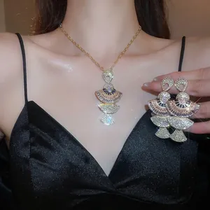 Elegant fan-shaped jewelry set with necklace and earrings featuring colorful crystals
