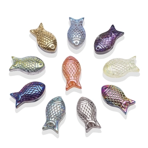 Macro shot of 8x15mm fish-shaped metal pendants in assorted metallic plating colors