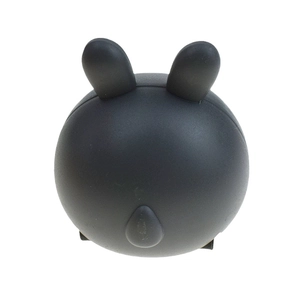 Close-up of black matte silicone bunny ear accessory for creative pull-back carrot car toy