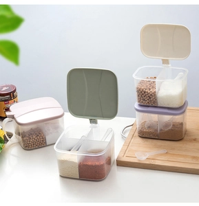Detail of four-compartment spice box with spoons and easy-open lids for kitchen storage