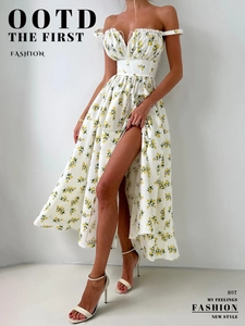 Detailed close-up of lemon print dress featuring ruched neckline and high slit detail