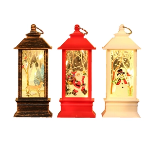 Three LED Christmas lanterns with Santa, reindeer and snowman designs in bronze, red and white
