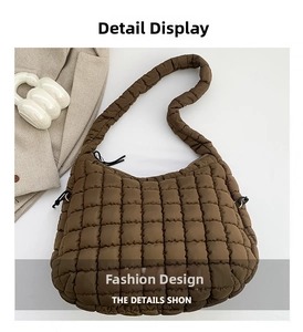 Detail shot of brown quilted puffy tote bag featuring square texture and drawstring