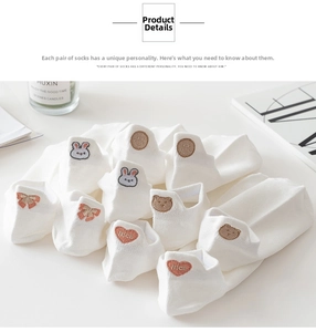 Close-up of white cotton ankle socks featuring cute bunny and heart embroidery detail